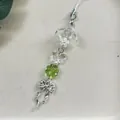 Ciondolo per telefono con quadrifoglio creativo, perline acriliche e nappa a fiocco - Stile con Fiocco e Quadrifoglio Verde Fatto a Mano con Perline (1)