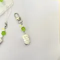 Cute white plush sea otter keychain with green clover beads and a metal lobster clasp - Silver Lobster Clasp Style
