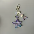 Mermaid tail and starfish iridescent resin keychain with ocean-themed beaded charms - Lobster Clasp Style