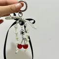 Elegante portachiavi di perle con nastro nero e ciondoli a forma di palla da biliardo - Stile con Perline e Fiocco Bianco e Nero (Stile 1)