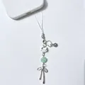 Cute cat bead phone charm with silver bow pendant and green clover on white cord - Phone Chain
