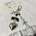 Portachiavi cuore argento con fiocco nero e stelle su sfondo di pizzo bianco - Stile Fiocco in Raso (款2)