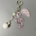 Cute pink G-clef musical note keychain with plush ball and star pattern details - Pink Glitter Star G-Clef Style