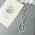 G-Clef Perlen-Handyanhänger mit blauen Perlen und Stern-Anhänger an einem Karabinerverschluss - Verschluss-Stil