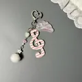 Pink striped G-clef and purple angel wing keychain with white heart beads and a soft pompom - Pink Striped G-Clef Style