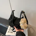 Chic black suede crescent handbag with plush pendant and detachable shoulder strap - Black With Pendant