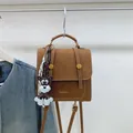 Brown retro square backpack with white stitching and cute schnauzer bag charm - Brown with Pendant