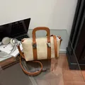 Caramel leather and beige straw patchwork crossbody handbag with top handle and strap - Off White