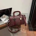 Retro burgundy boston bag in woven texture faux leather with silver-tone hardware - Purple