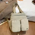 Minimalist beige nylon multi-purpose tote bag with functional double front pockets - Khaki