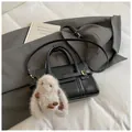 Minimalist black handbag with white contrast stitching and cute plush rabbit charm - Black with Pendant