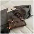 Dark brown structured handbag with white stitching and golden buckles for work - Coffee without Pendant