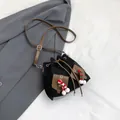 Retro black drawstring bucket bag with brown leather strap and festive pompom charms - Black