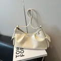 Cream pleated hobo bag in soft faux leather with side pockets and silver buckle strap - No Pendant / White