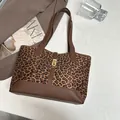 Chic leopard print tote bag with brown leather trim and golden buckle detail - Brown Leopard