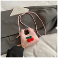 Pink plush mini crossbody bag with red knitted cherry charms and thin shoulder strap - Red