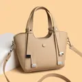 Minimalist beige pebble leather handbag with silver accents and detachable shoulder strap - Light Khaki
