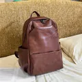 Mochila vintage de cuero sintético marrón oscuro con gran bolsillo frontal y diseño retro - Marrón Rojo