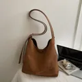 Dark brown suede hobo bag with large capacity and minimalist vintage design - Brown