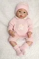 Detailed view of reborn baby doll in pink knitted outfit with bear embroidery - Pink / 55 cm