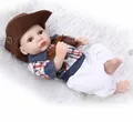 Realistic mini baby doll boy in cowboy outfit and plaid shirt on soft white faux fur - Cowboy Style (3) / 27cm