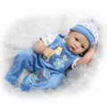 Lifelike baby reborn doll in blue velvet overalls with a small nursing bottle - Blue (Boy) / 55 cm