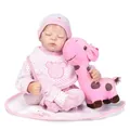 Sleeping reborn baby doll in pink stripe outfit holding a plush giraffe toy - 50 cm / Pink