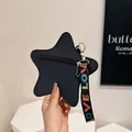 Star-shaped crossbody bag in black pebbled leather with a colorful LOVE strap handle - Black