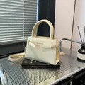 Cream white structured handbag with golden lettering and detachable shoulder strap - White