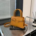Retro ginger yellow crossbody square bag with elegant top handles and strap - Brown
