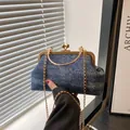 Blue denim shell bag with sparkling rhinestones and golden metal frame handle - Dark Blue