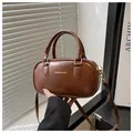 Mini retro dark brown PU leather Boston bag with fashion logo and gold hardware - Brown