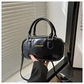 Mini retro black glossy leather handbag with golden metal hardware and strap - Black