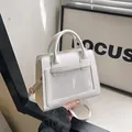 Minimalist white PU leather crossbody bag with a transparent front PVC window and dual handles - White