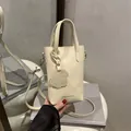 Petit sac à main blanc crème en cuir avec pendentif chien et bandoulière réglable - Blanc