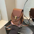 Brown mini crossbody phone bag with vintage woven texture and golden twist lock - Brown