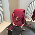 Mini red woven crossbody phone bag with gold clasp and elegant leather shoulder strap - Red