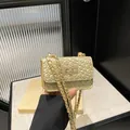 Mini borsa a tracolla dorata in pelle intrecciata con chiusura a girello - Oro