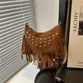 Bohemian brown suede crossbody bag with vintage golden studs and long fringe tassels - Brown