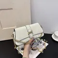 White marble pattern baguette bag with gold chain and green pearl bead accents - White
