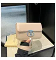 Elegant beige textured crossbody bag with silver chain strap and artistic metal clasp - Khaki