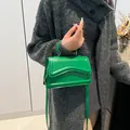 Vibrant bright green crossbody bag with top handle and curved texture on front flap - Green