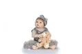 Detail of reborn doll with brown hair, blue eyes, sparkling tutu and plush bear - Gray Dress Style / 56cm