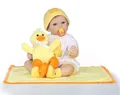 Macro detail of lifelike reborn baby doll wearing duck-themed outfit and knit hat - Amber White / 50 cm