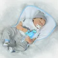 Realistic sleeping reborn baby doll in blue dinosaur outfit with pacifier and bottle - Closed Eyes Style