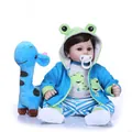 Realistic reborn baby doll in frog hoodie with giraffe plush toy on white background - Blue