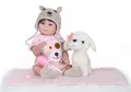 Realistic reborn baby doll set with pink puppy outfit and accessories in a studio view - Pink Puppy Romper Style (48cm)