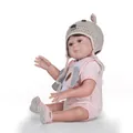 Close-up of realistic reborn doll wearing a striped bodysuit and knitted animal ear hat - 49cm / Pink