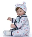 Realistic reborn baby boy doll wearing a cartoon pattern romper and bear ear hat - Bear Print Romper Style / White / 52cm