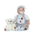 Realistic reborn baby doll in blue stripe outfit with teddy bear on white background - Blue / 55 cm